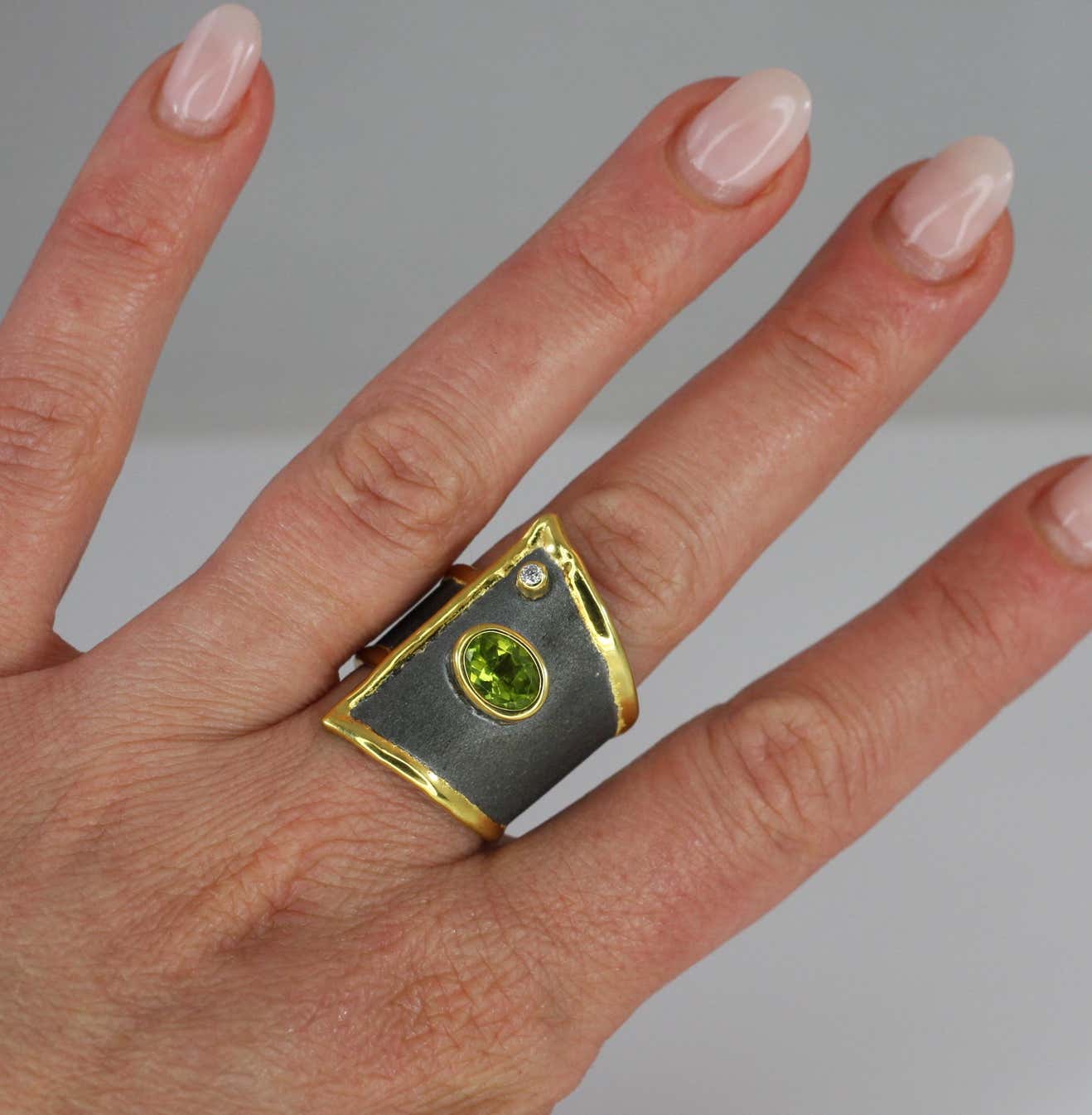 Eclyps Peridot and Diamond Ring in Fine Silver Ruthenium and 24 K Gold
