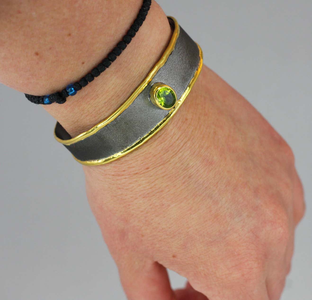 Eclyps Peridot Bracelet in Fine Silver Black Ruthenium 24 Karat Gold